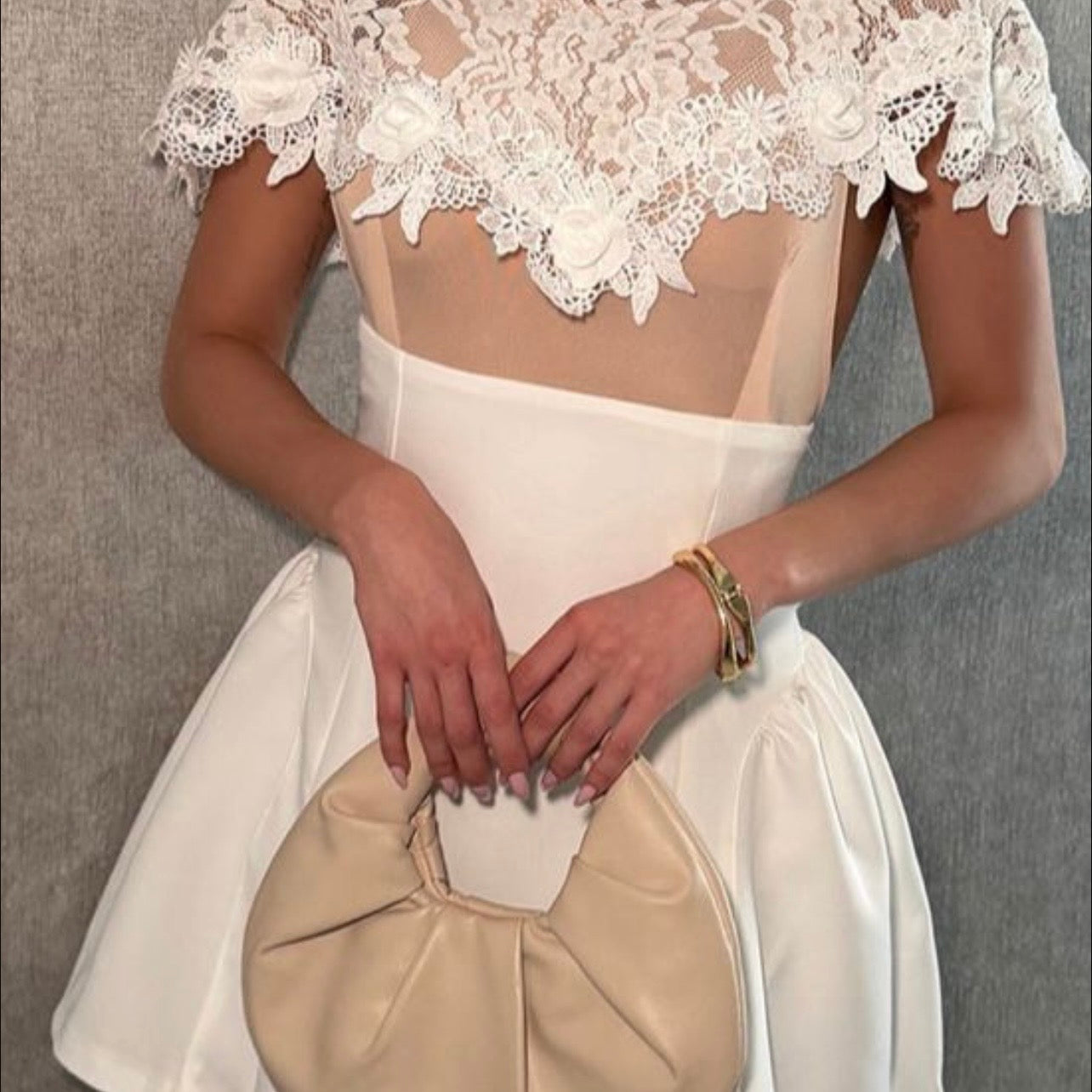 A lovely white dress—short and elegant.