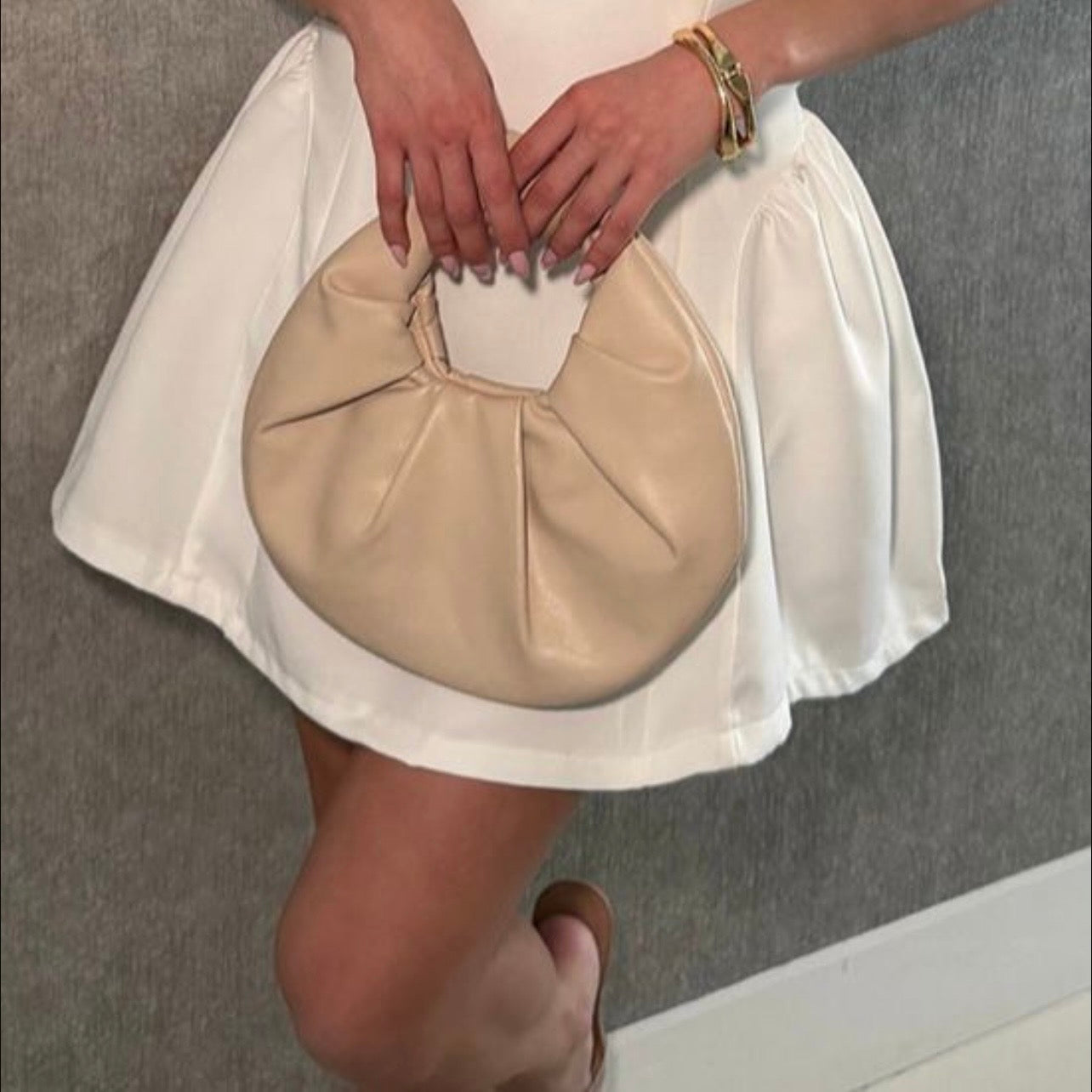 A lovely white dress—short and elegant.