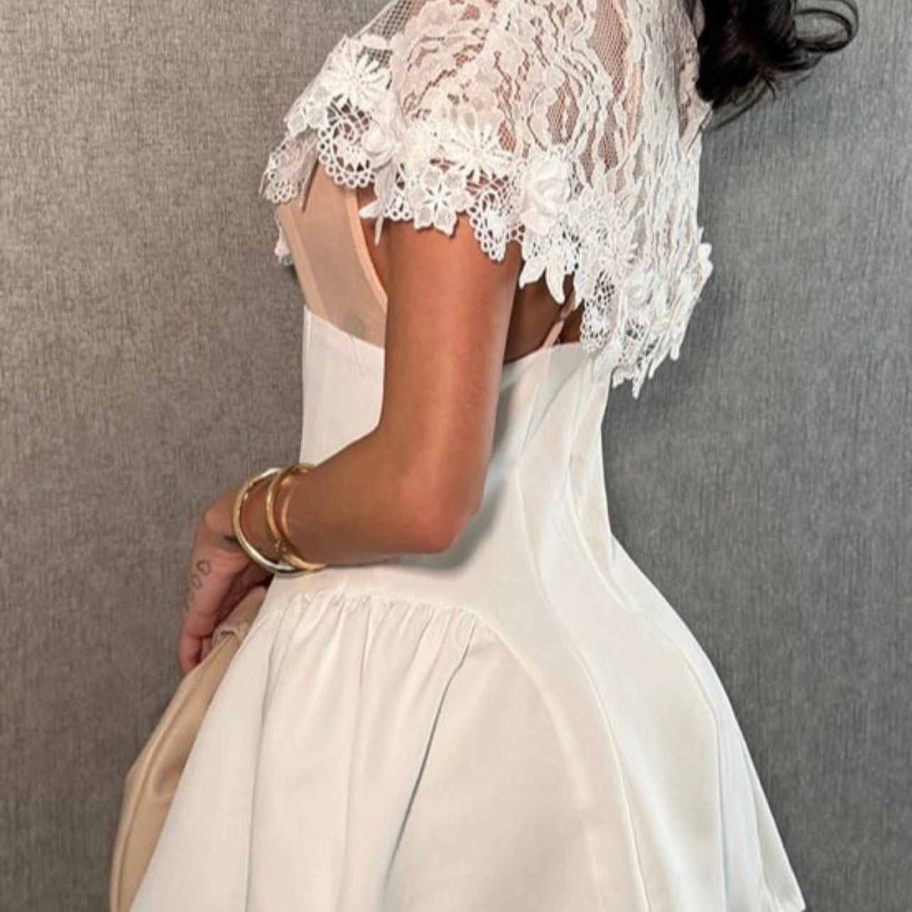 A lovely white dress—short and elegant.