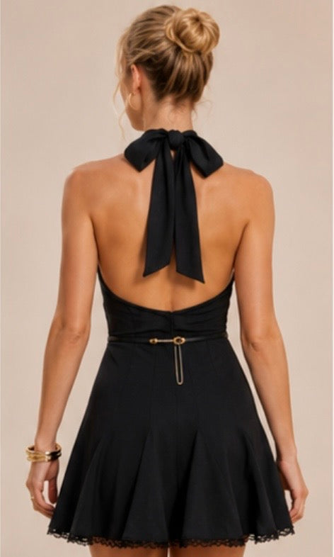Mini Dress features a halter neckline adorned with a central gold button detail