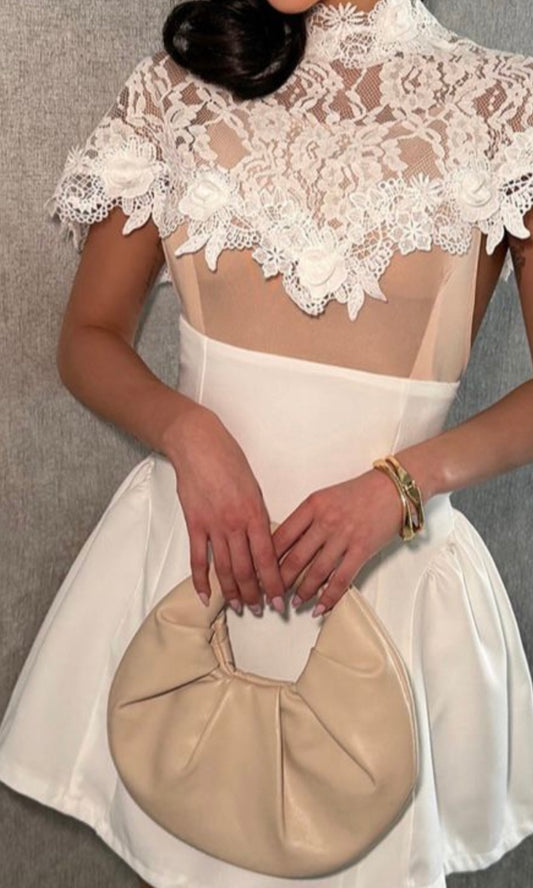 A lovely white dress—short and elegant.