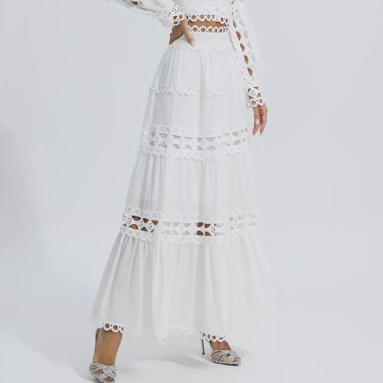 Two-piece white outfit with a skirt