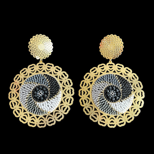 E. Large earrings designed in 24k gold plated bronze and black beads