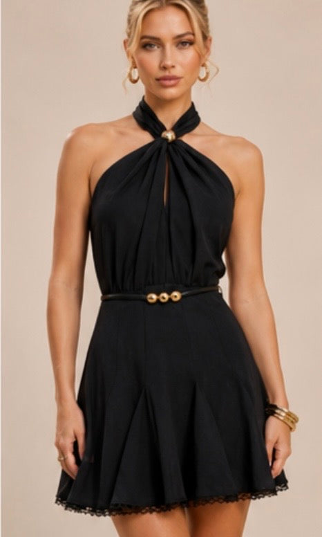 Mini Dress features a halter neckline adorned with a central gold button detail
