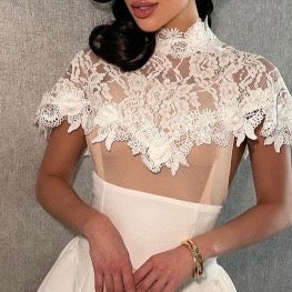 A lovely white dress—short and elegant.