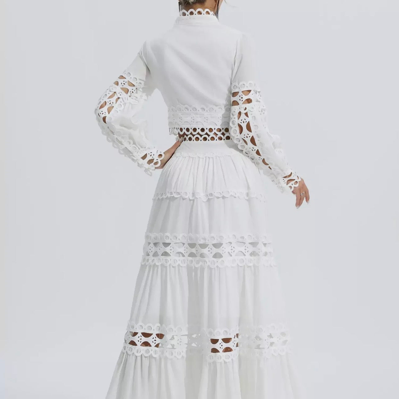 Two-piece white outfit with a skirt